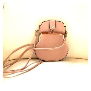 Sections for phone, cards, keys & cash. Leather.